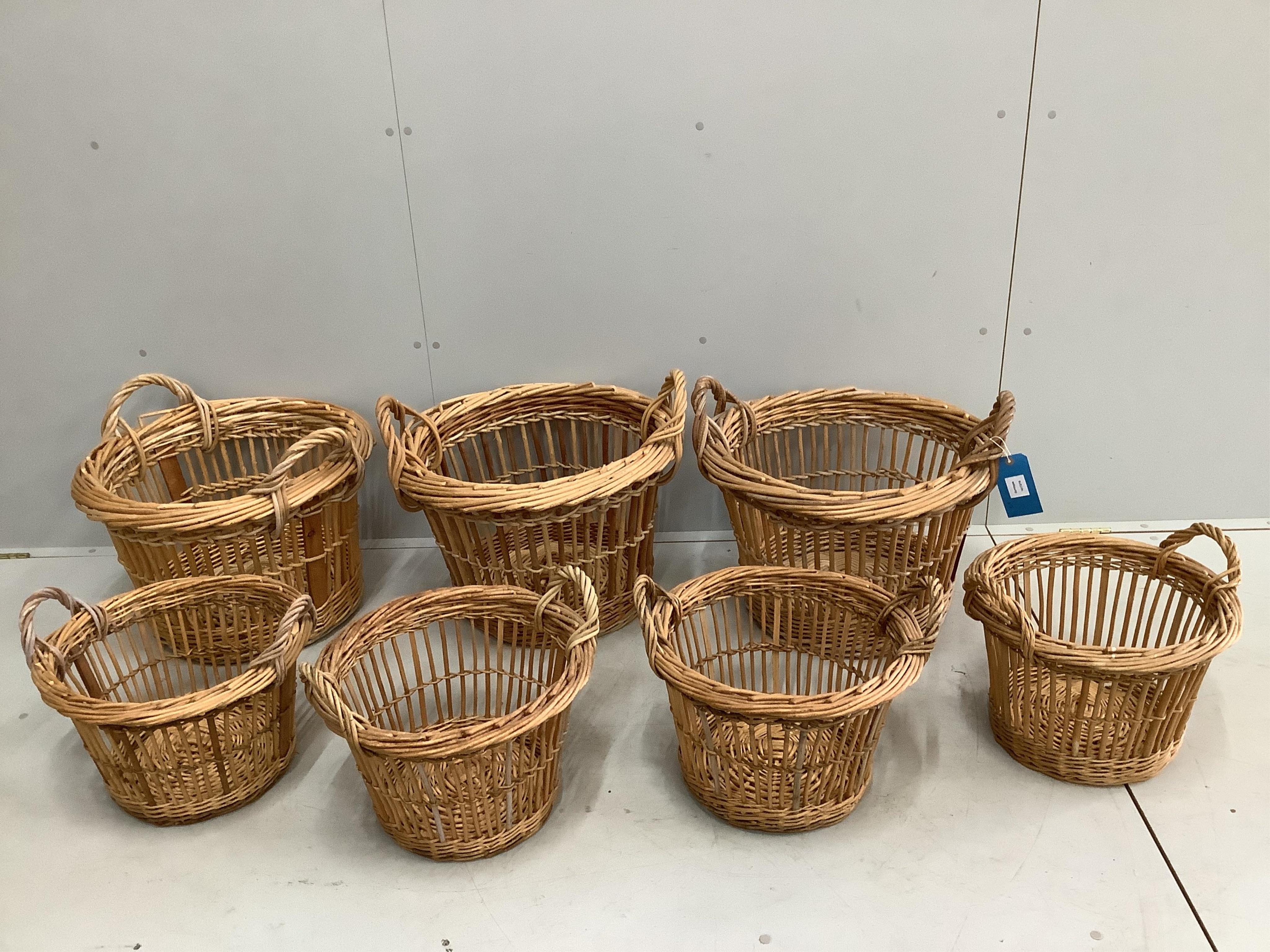 Seven circular wicker baskets, largest diameter 58cm. Condition - good